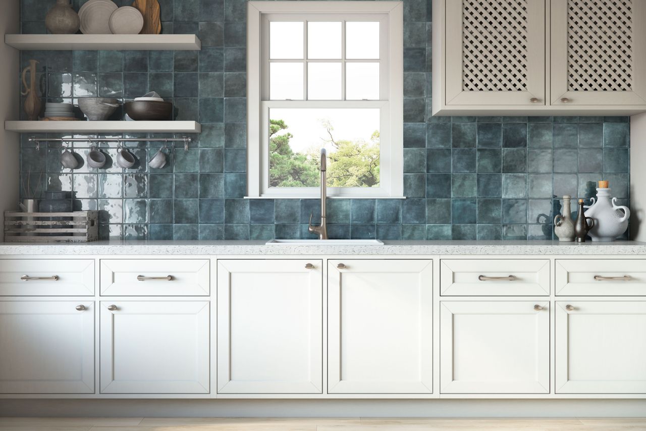Blue square ceramic tile kitchen backsplash.