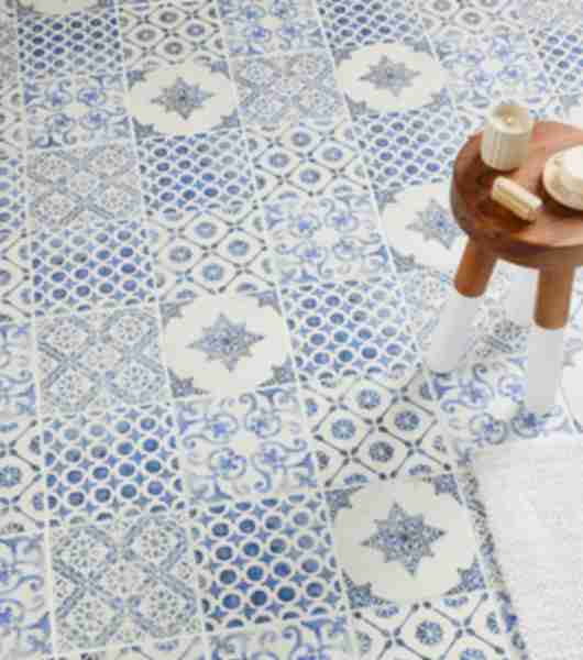 Blue and white patterned square tile with small wooden table.
