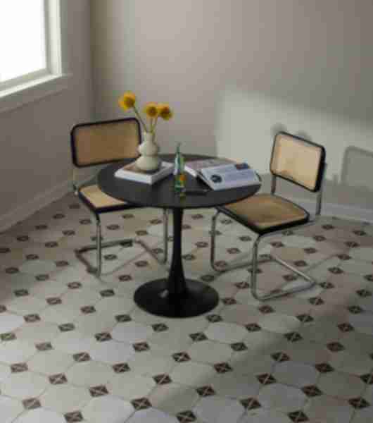 Kitchen with two chairs and a table tiled in Yard Black ceramic tile.