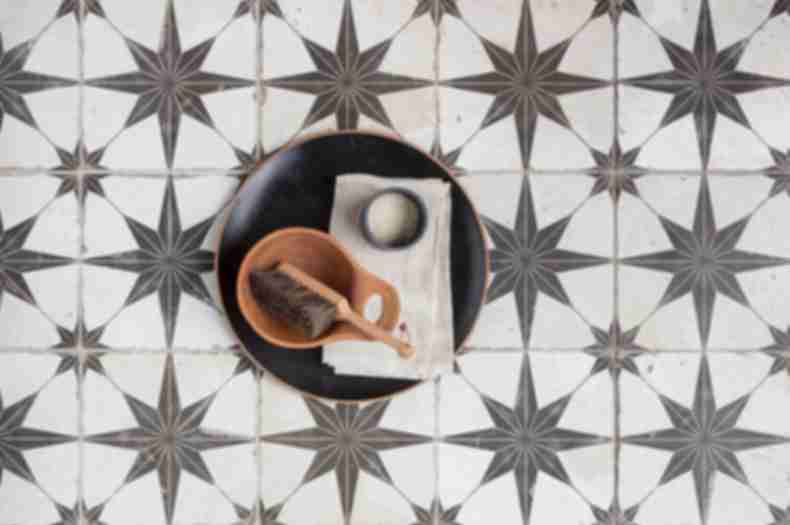 Black and white star encaustic floor tile.