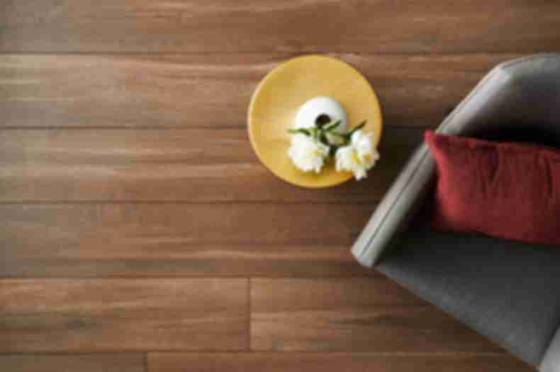 Large-format wood-look floor tile in living room.