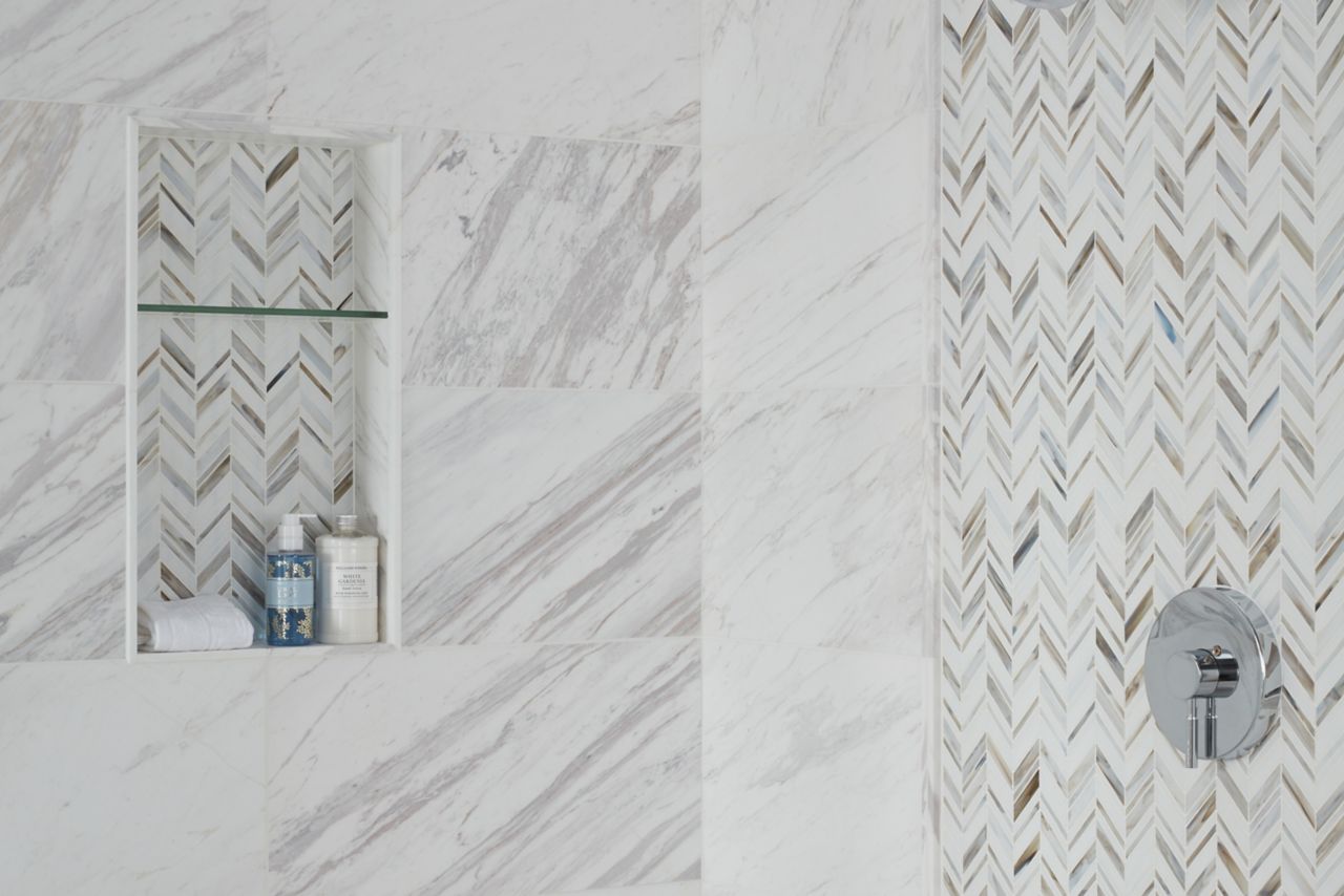 Shower wall natural stone and glass.