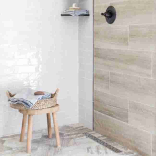 Shower with faux wood and subway tile.