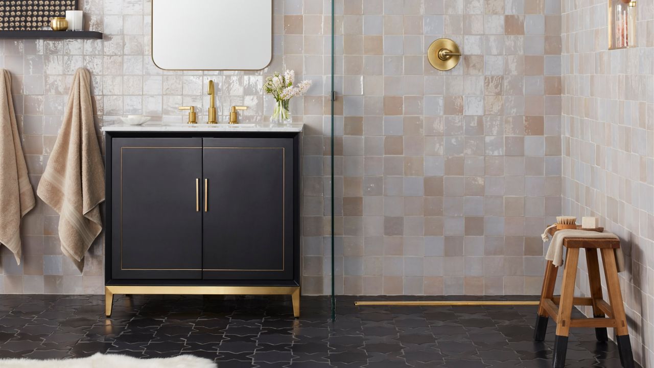 Bathroom with square handmade tile in varying shades of white, grey and cream.