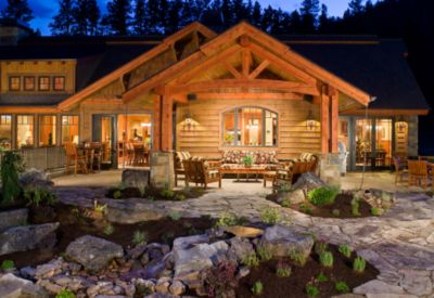 Back patio and outdoor speakers at the Mostad River Pines home