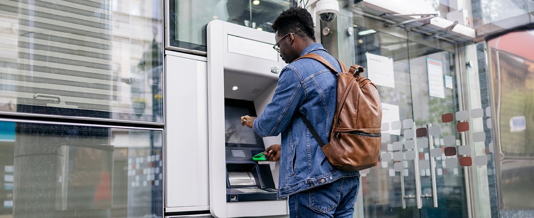 Man using bank machine