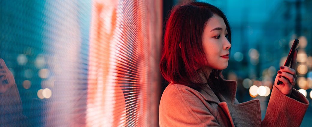 A fashionable young woman is captured in a portrait, showcasing her unique hairstyle and feminine charm.