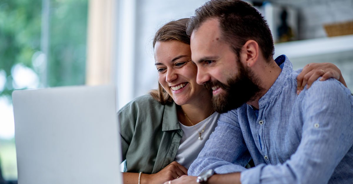 A happy couple in love, successfully navigating their shared business, exemplifies the power of teamwork.