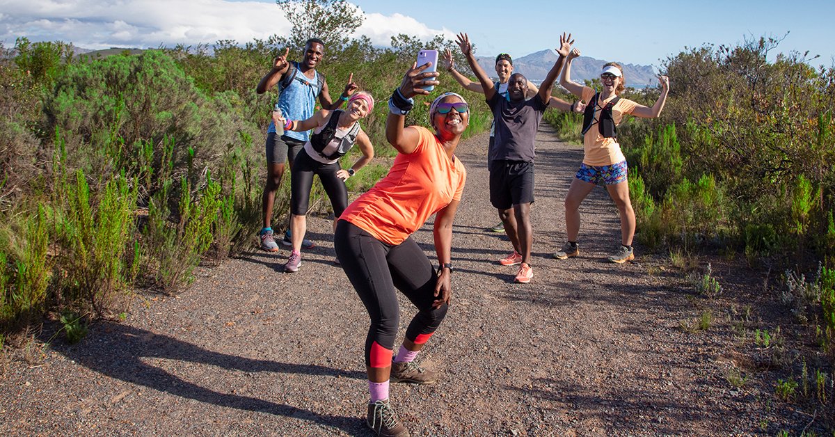 A joyful family, including a boy and a girl, engaging in an active hiking trip, delighting in the beauty of nature.