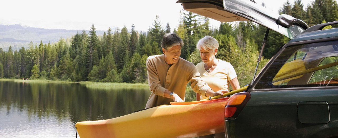 A happy couple enjoys a summer day outdoors, embracing moments of joy and togetherness in a cheerful, family-oriented setting.