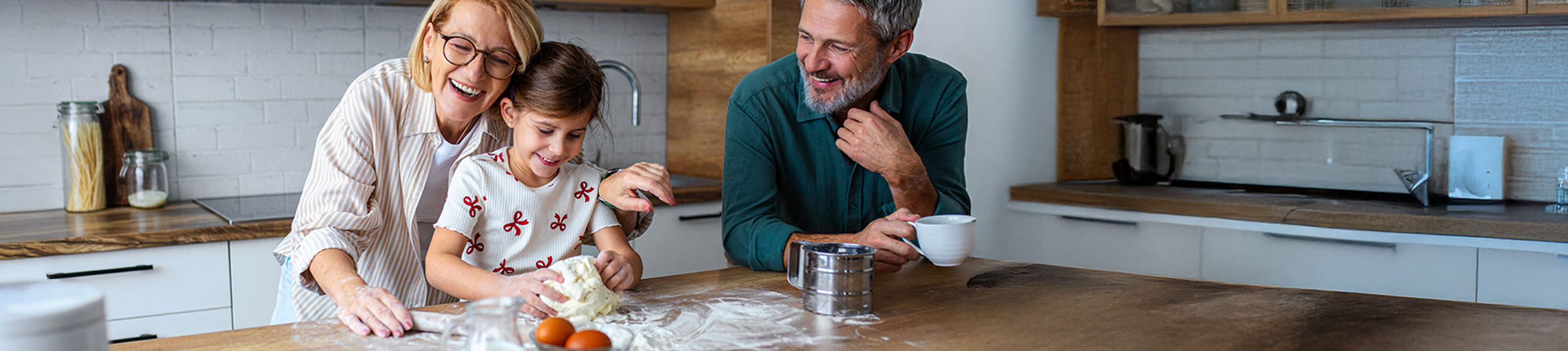 A family bakes in the kitchen