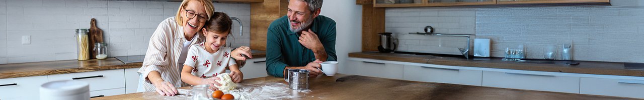 A family bakes in the kitchen