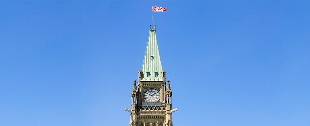 The old landmark church, with its towering clock and traditional architecture, beautifully punctuates the city's blue sky.