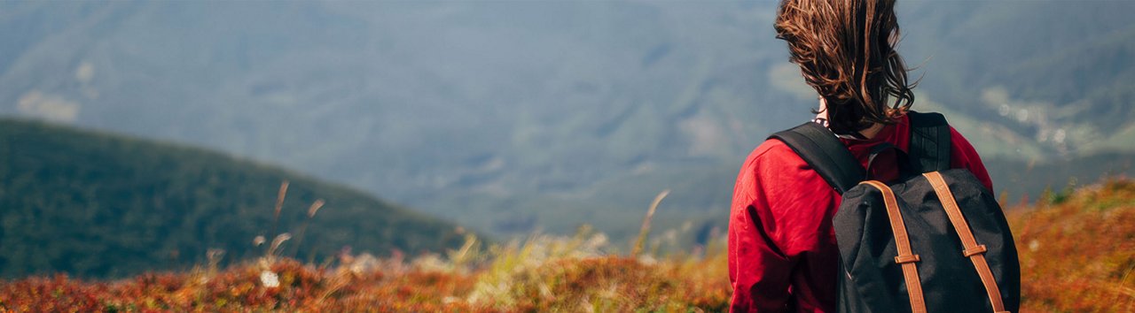 Person hiking with backpack.