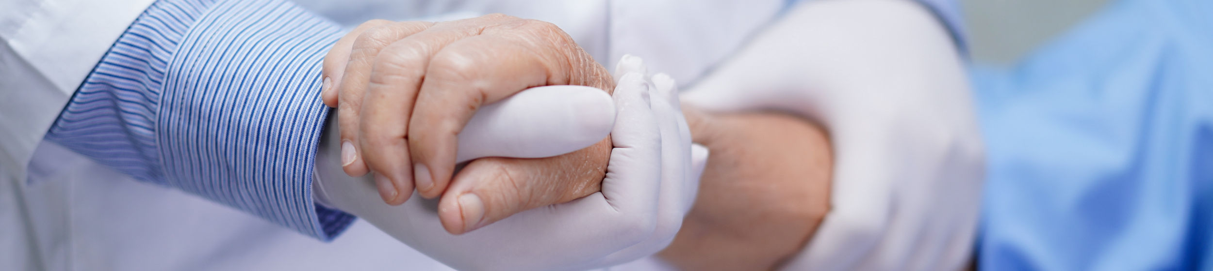 Doctor holding touching hands Asian senior or elderly old lady woman patient with love, care, helping, encourage and empathy at nursing hospital ward : healthy strong medical concept