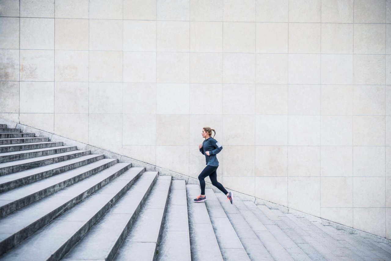 Woman running up stairs