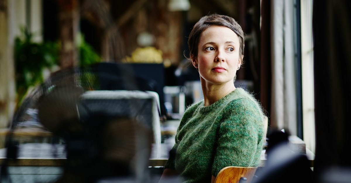 A young adult woman navigates her way through the bustling city, embodying the spirit of modern femininity.