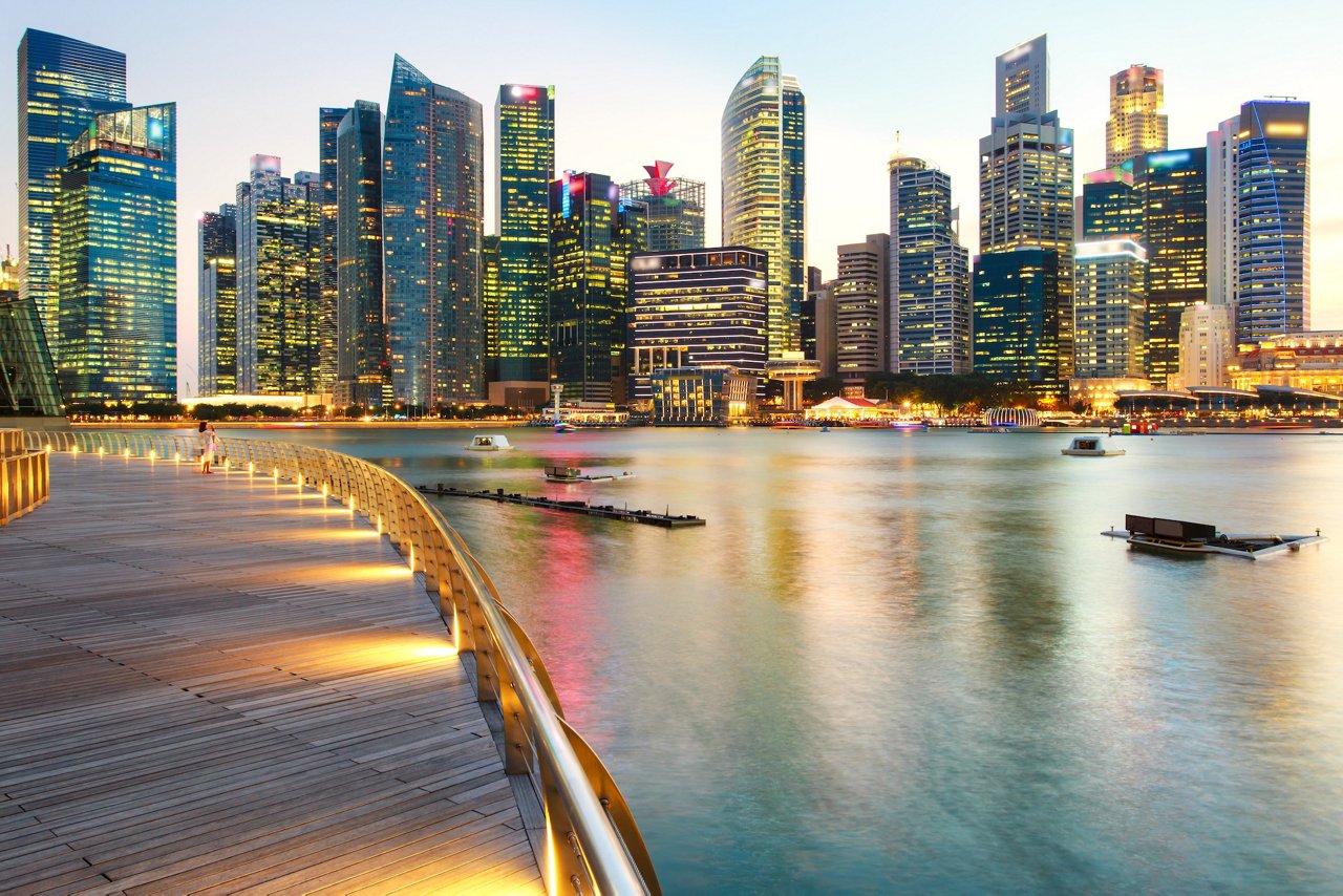 Colorful lights architecture business building and financial district in sunset time at Singapore City.