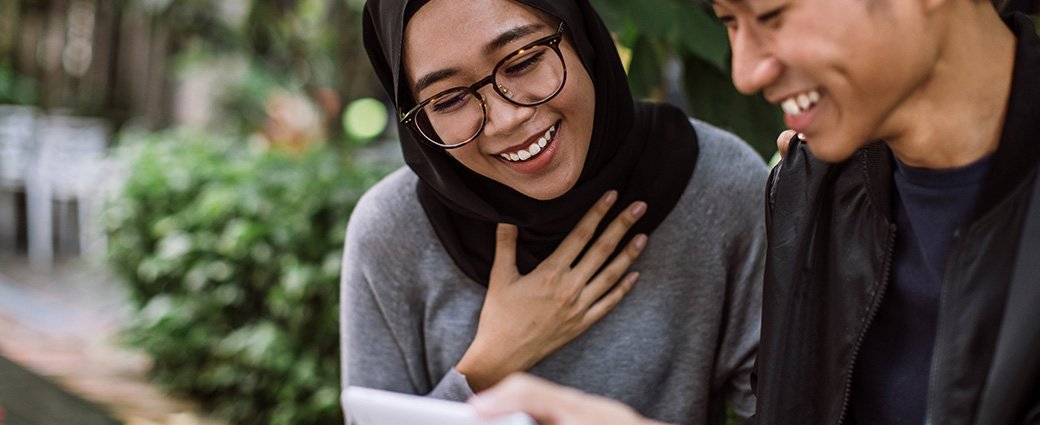 A professional portrait showcasing a young adult female, presenting her face with an air of confidence.