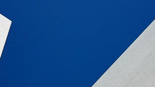 Low Angle View Of Building Against Blue Sky