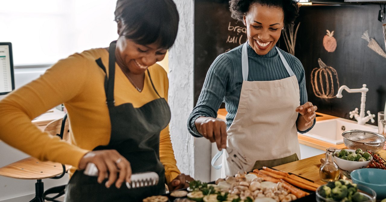 Two women cooking in a kitchen