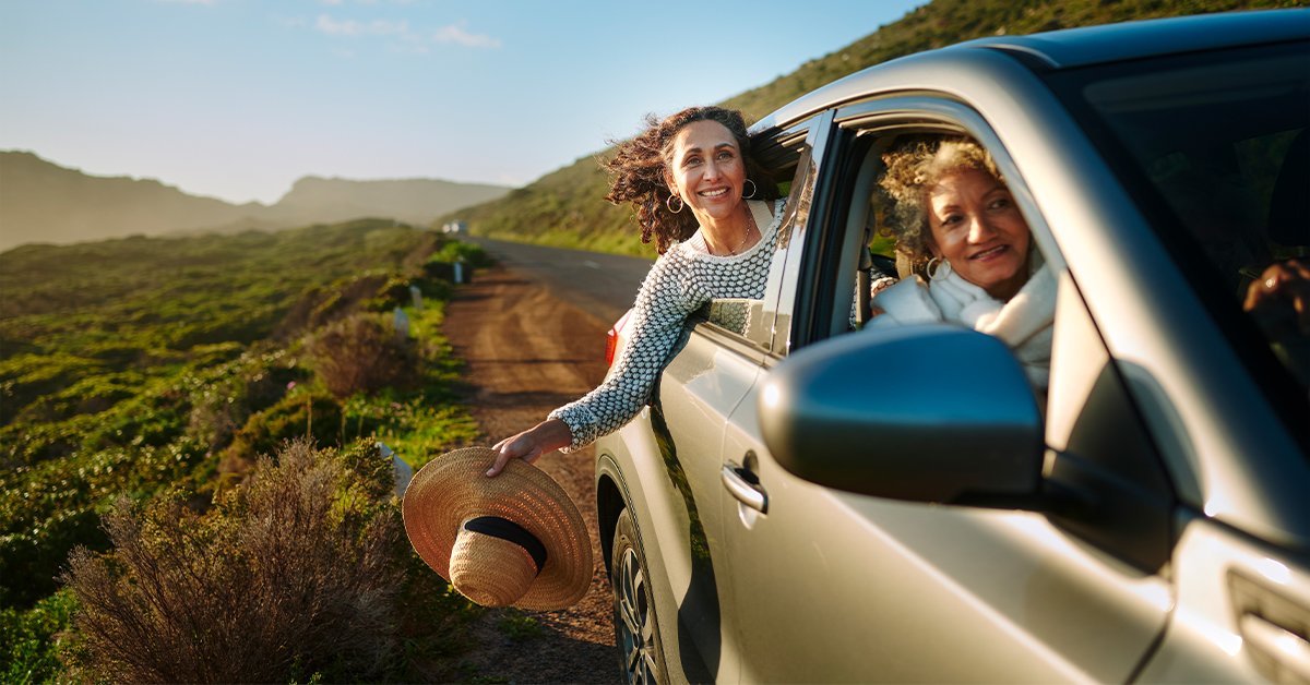  Two women are driving on a country road