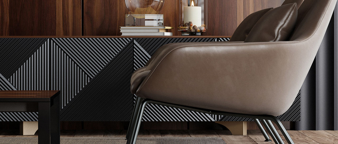 Contemporary living room interior featuring a sleek wood-paneled wall and low sideboard with geometric patterns. A modern table lamp and decorative glass dome sit on the cabinet, adding subtle accents. A low coffee table with books and decor stands in front of a cushioned lounge chair. Neutral tones, clean lines, and soft lighting create a calm, sophisticated atmosphere.