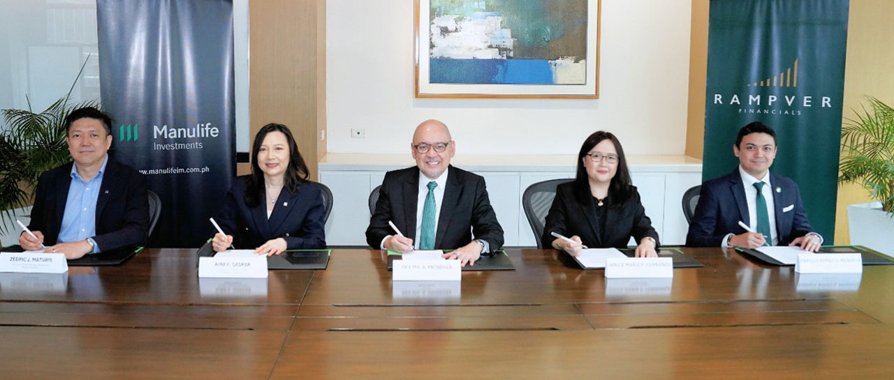 Business executives signing corporate partnership agreement