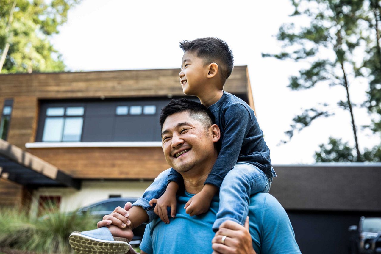 A father carrying his child on the shoulder
