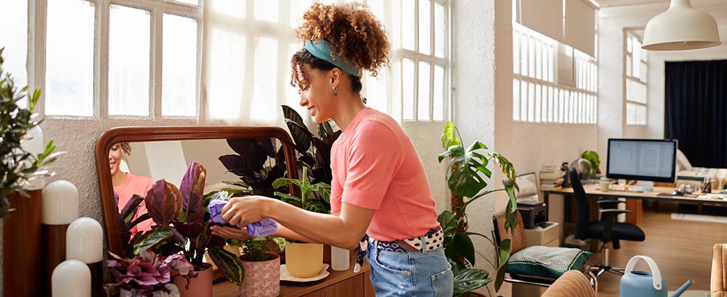 Woman cleaning her living room