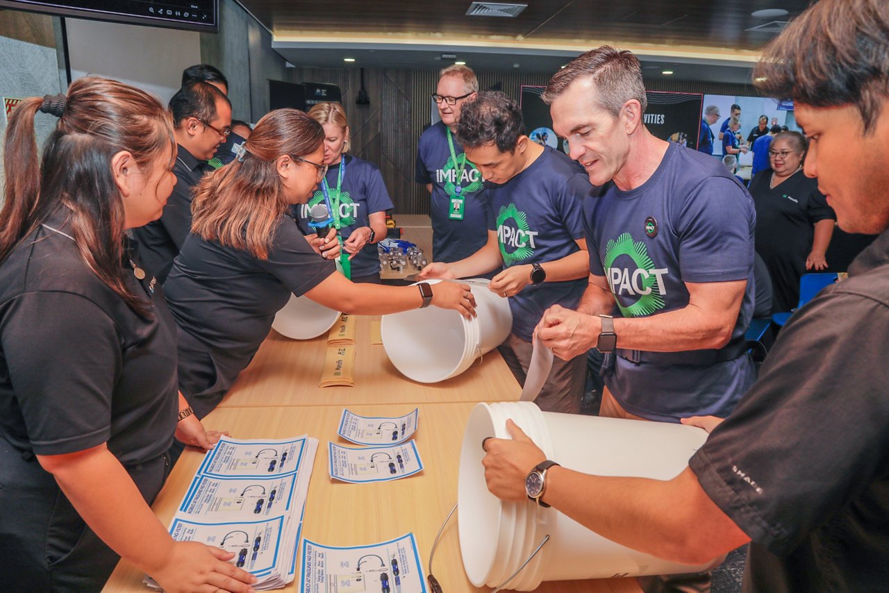 Asia CEO of Manulife joined volunteers in packaging assembly for water filtration kits