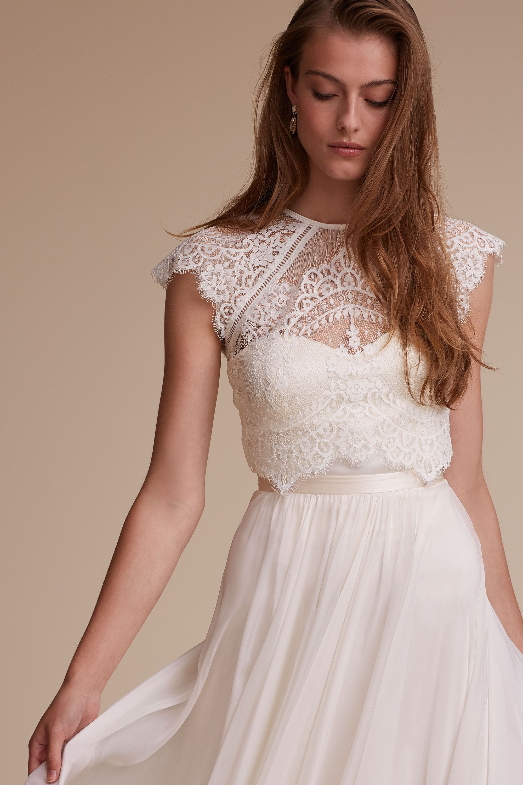 Image of white dresses that cover shoulders