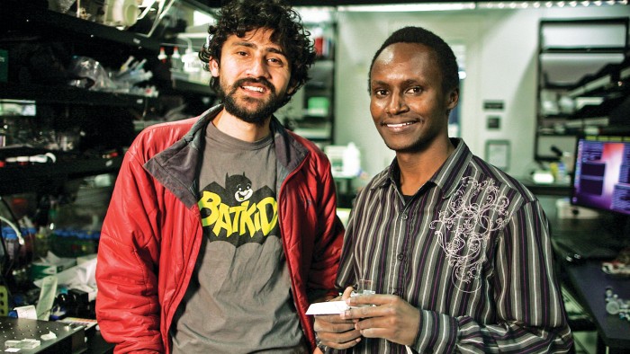 Manu Prakash (left) and George Korir (right) won the top prize in the SPARK competition for their punch-card microfluidics device.