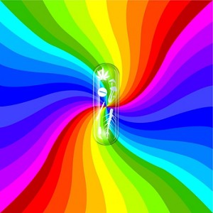 A clear capsule in from on a colorful background.