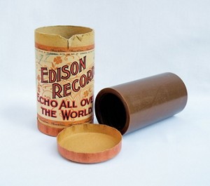 A photograph shows an early brown wax cylinder made by Thomas Edison’s company.
