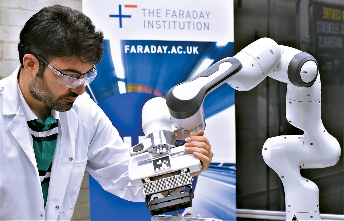 This photo shows a researcher at the University of Birmingham using a robotic arm to study Li-ion battery recycling.