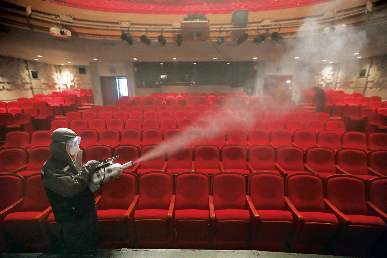 A theater is sprayed with a disinfectant.