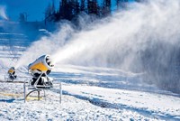 Premium Photo  Snow cannon in winter mountains. snow-gun spraying  artificial ice crystals. machine making snow.