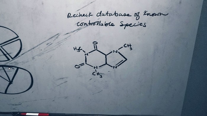 A screen capture from the video game Starfield shows a whiteboard with a molecule that looks a lot like caffeine but is lacking one double bond.