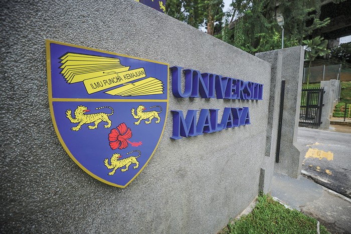 The logo of University of Malaya at an entrance to the school.