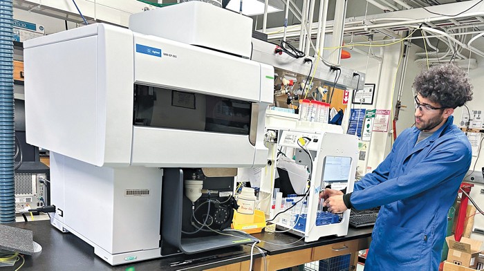 Erfan Oftadeh, a second-year graduate student in Bruce Lipshutz’s lab, entering a sample into an inductively coupled plasma mass spectrometer for elemental analysis.