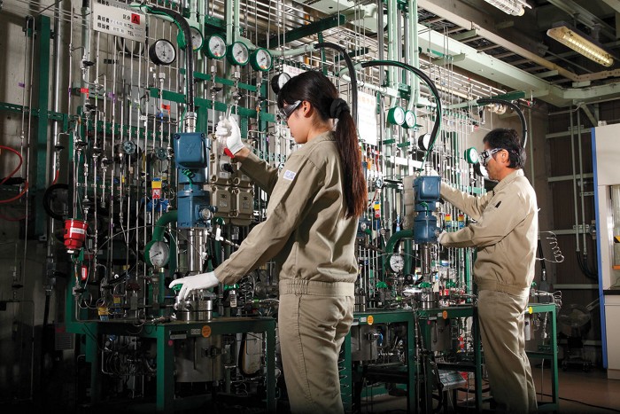 Two people at work in a research facility.