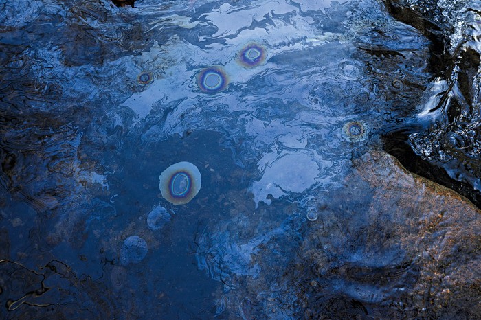A rainbow-colored sheen on Sulphur Run. 