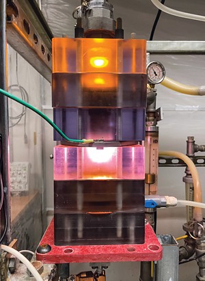 A flickering fire-like plasma inside blocklike modules of clear polycarbonate plastic.