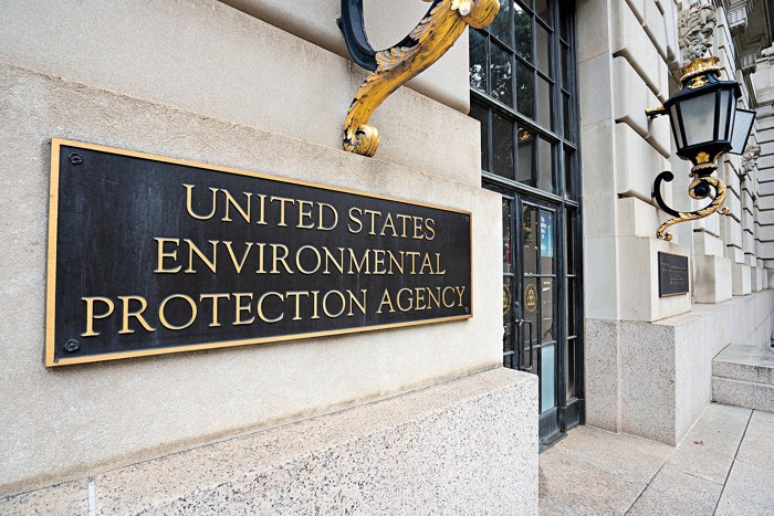 A close-up of a sign that reads "United States Environmental Protection Agency" on the agency's headquarters building.