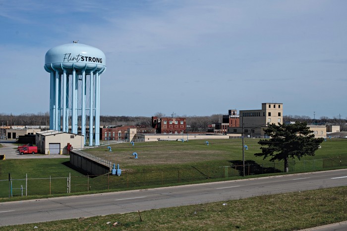 Water tower with the words “Flint Strong” painted on it.