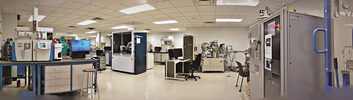 A panoramic photo of a core laboratory shows between 5 and 10 benchtop and freestanding instruments.