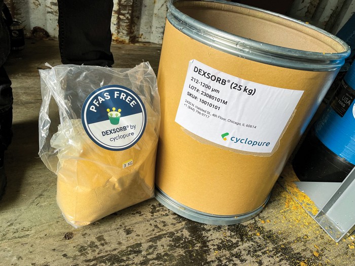 Yellow powder consisting of plant-based β-cyclodextrins in a plastic bag next to a storage container.