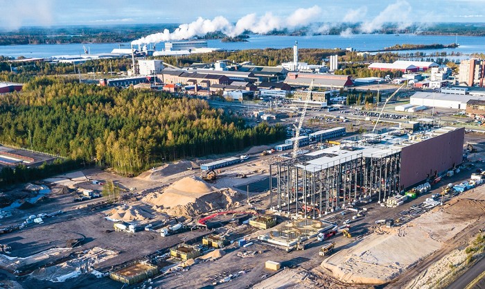 An overhead view of an industrial facility along a coast.