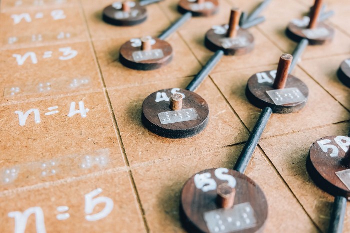 A close-up of a hands-on science activity that incorporates braille.